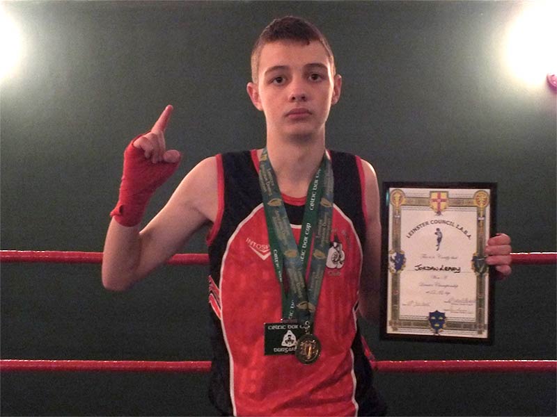Urlingford Boxing Club's Jordan Leahy pictured receiving his championship honours from Leinster Council IABA. Photo: Urlingford Boxing Club